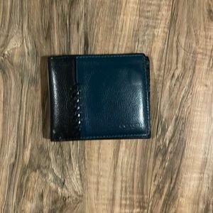 Blue coach billfold wallet.